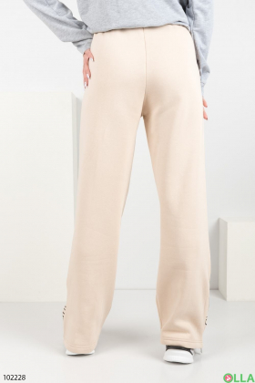 Жіночі зимові світло-бежеві спортивні брюки