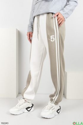 Жіночі зимові сіро-бежеві спортивні брюки