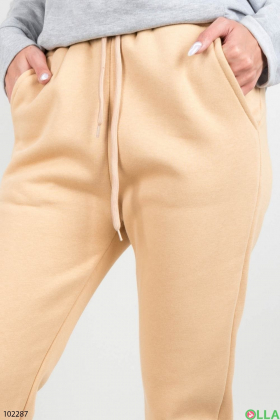Жіночі зимові світло-бежеві спортивні брюки