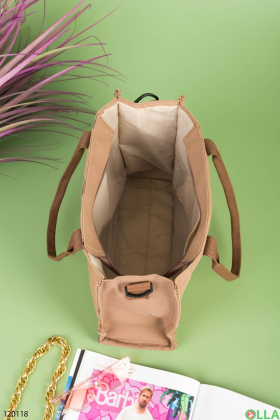 Жіноча коричнева сумка в принт