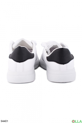 Women's white sneakers with black back
