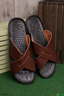 Brown flip flops with black soles