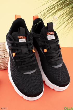 Men's black and gray sneakers with orange inserts