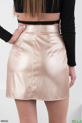 Женская юбка золотистого цвета из эко-кожи
