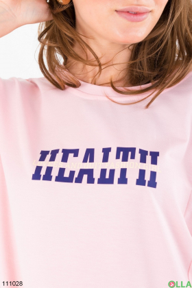 Women's pink oversized t-shirt with slogan